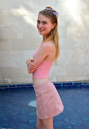 Slim blonde posing with her pussy exposed at the local store