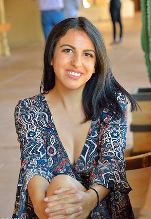 Dark-haired beauty in a sexy dress flashing her naughty bits in public