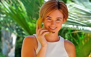 Short-haired stunner showing her long legs, perfect pussy, and food fetish