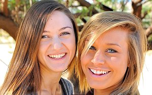 Two friendly girls get extra-friendly in a lesbo outdoor gallery
