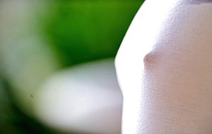 Small-breasted babe shows her perky booty and tiny ass for the camera