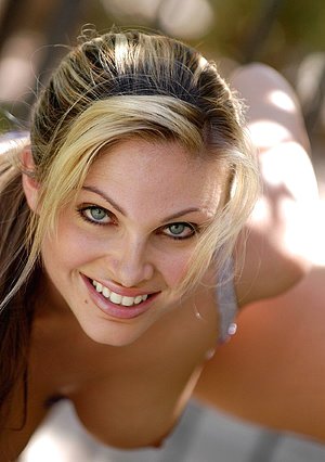 Blue-eyed blondie in sexy lingerie having lots of fun for the camera