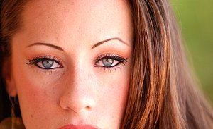 Attractive older gal shows her ass and tits in a hot outdoor gallery